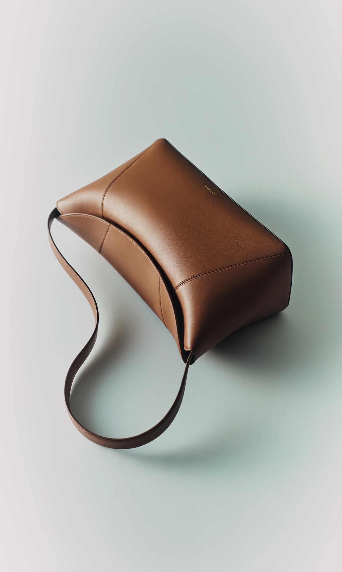 A rectangular leather bag with a single strap.