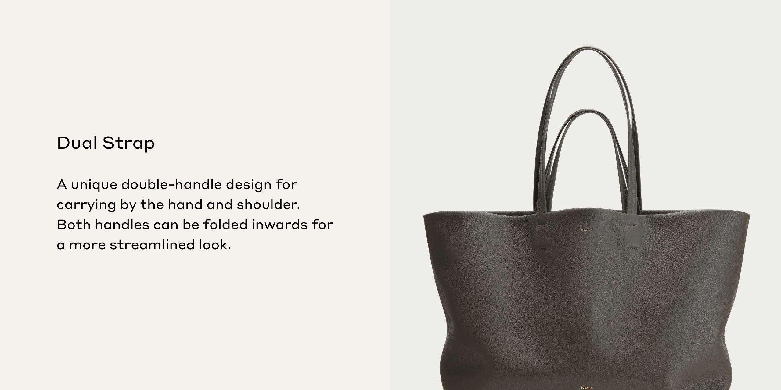 Handbag with two handles displayed upright against a plain background.