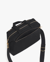 Travel bag with shoulder strap and zippered compartments