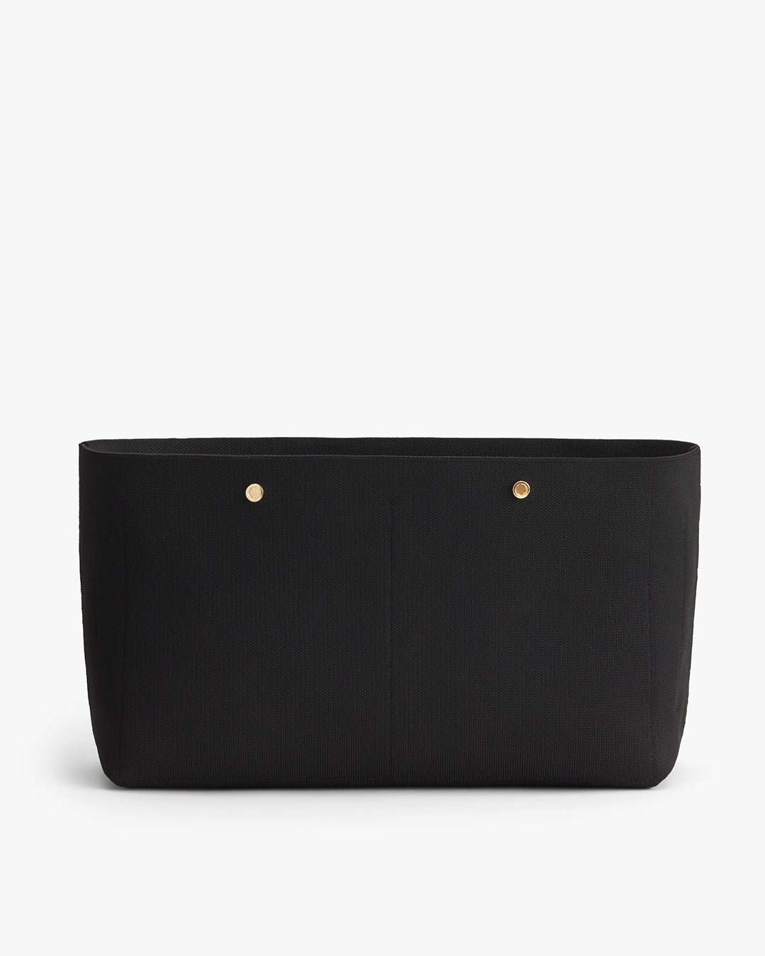 Black handbag with two front pockets and gold-tone rivets.