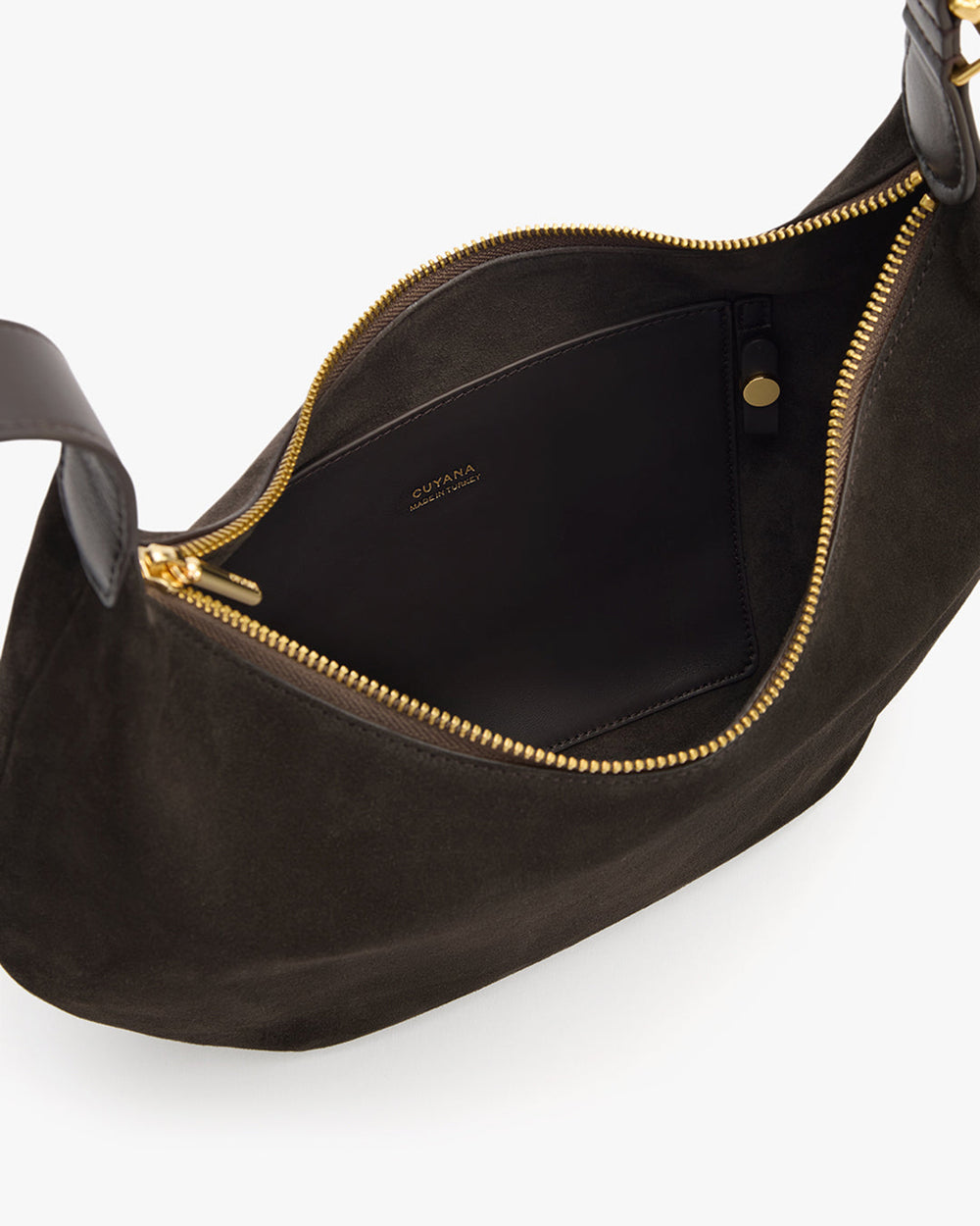 Open handbag with a zippered pocket inside.
