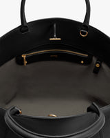 Open handbag interior with a zippered pocket and two handles.