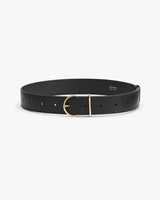 Leather belt with gold buckle on white background