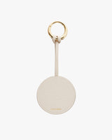Keychain with a circular tag and metal ring, branded logo visible.
