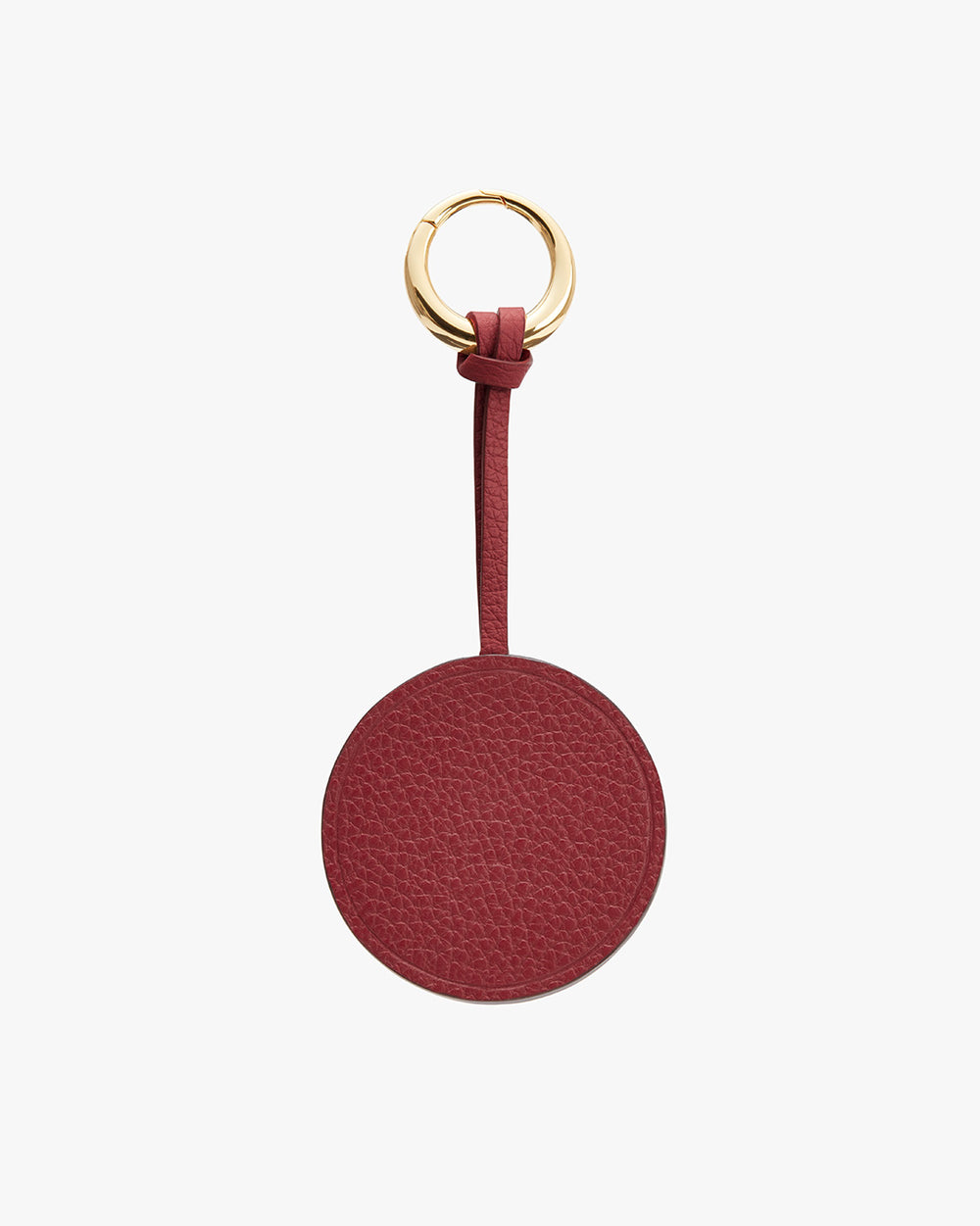 Keychain with a circular tag and metal ring.