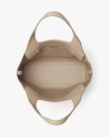 Open handbag viewed from above showing interior and handles.