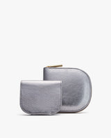 Two wallets, one larger with a zipper and one smaller, displayed upright.