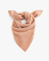 Knotted neck scarf on a plain background