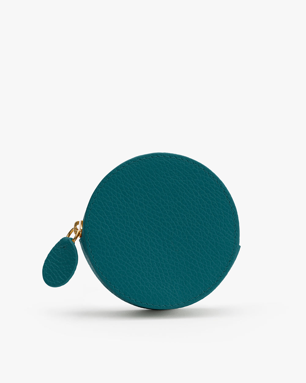 Round coin purse with zipper and small tab.