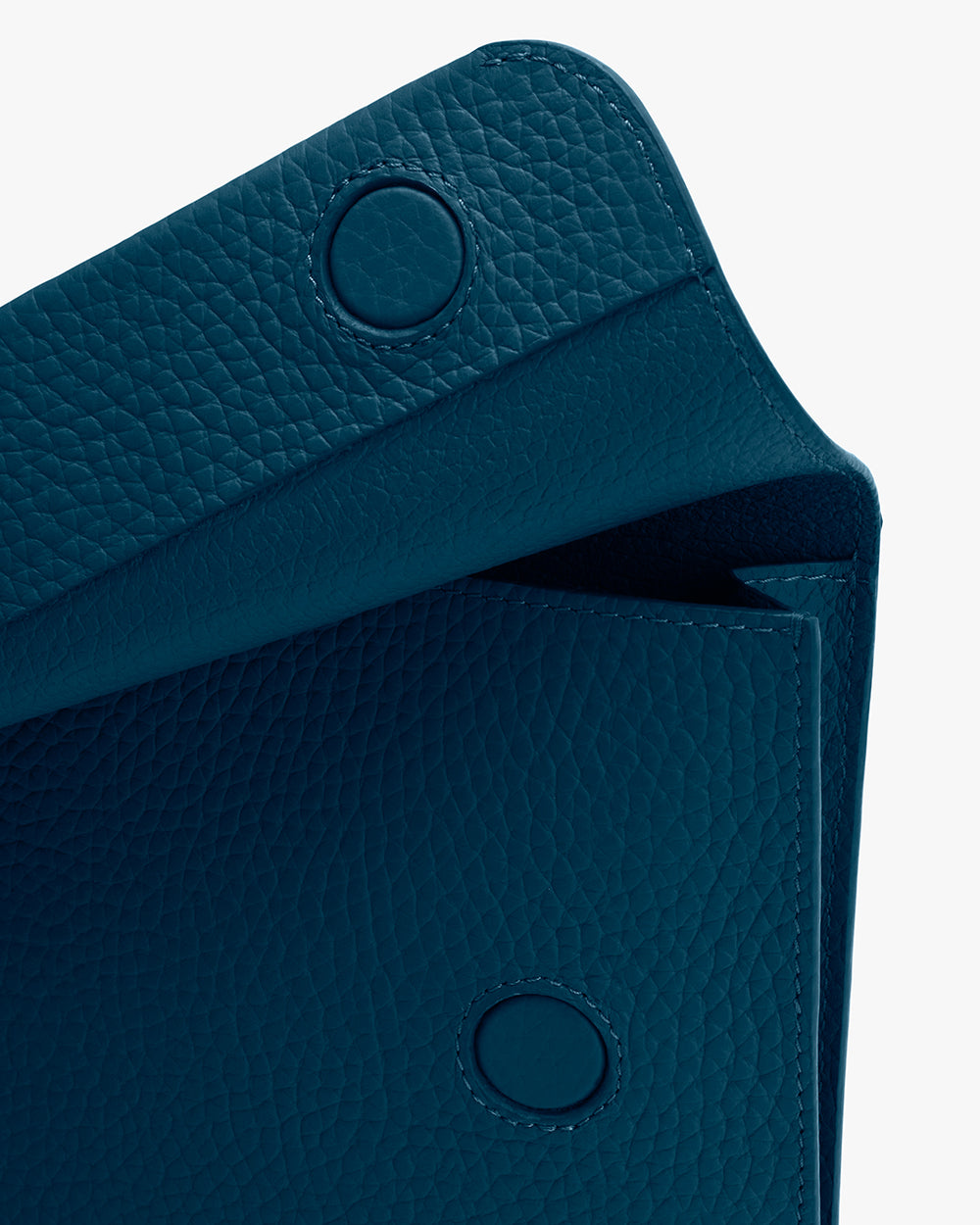 Textured clutch bag with button closures.