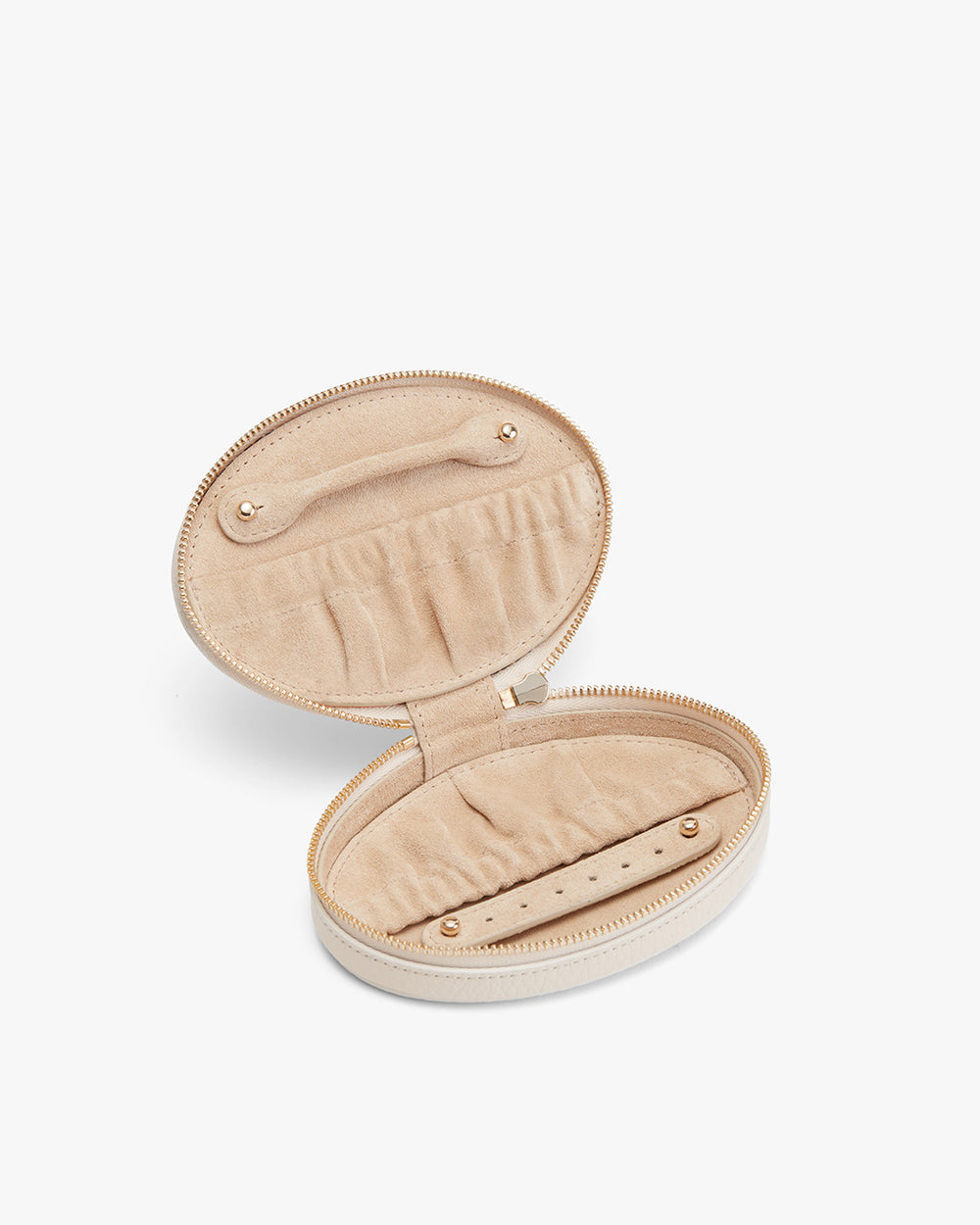 Open round jewelry case with pockets and a zipper closure.