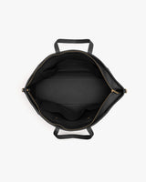 Top view of an open travel bag showing internal compartments and handles.