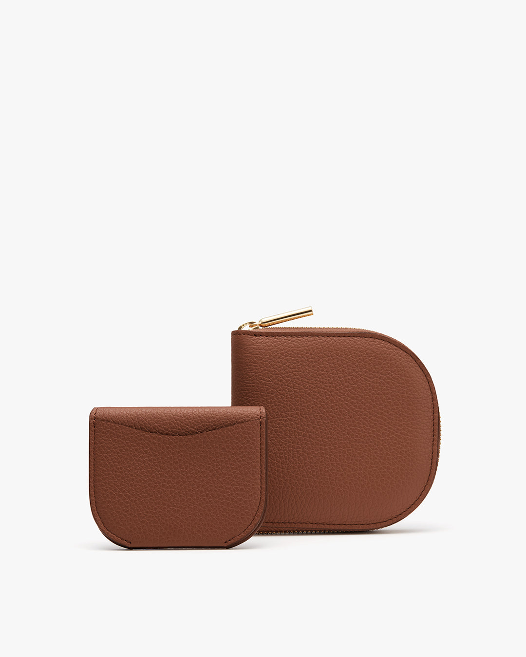 Two simple wallets placed side by side. The larger one with zipper
