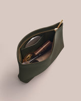 Open pouch with cosmetics inside