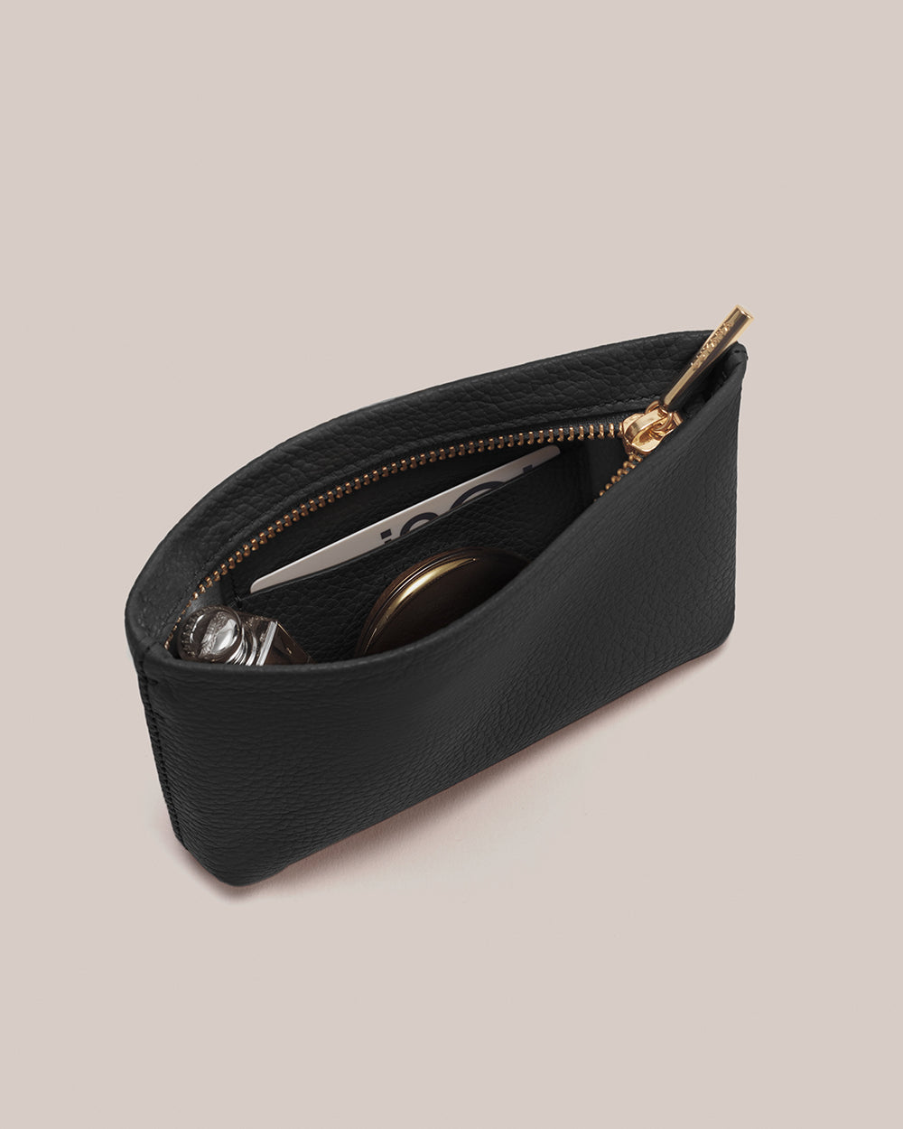 Pouch with zipper open, containing small items.