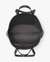 Open top view of an empty backpack with two handles.