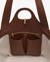 Open tote bag with inner pockets and a zippered compartment