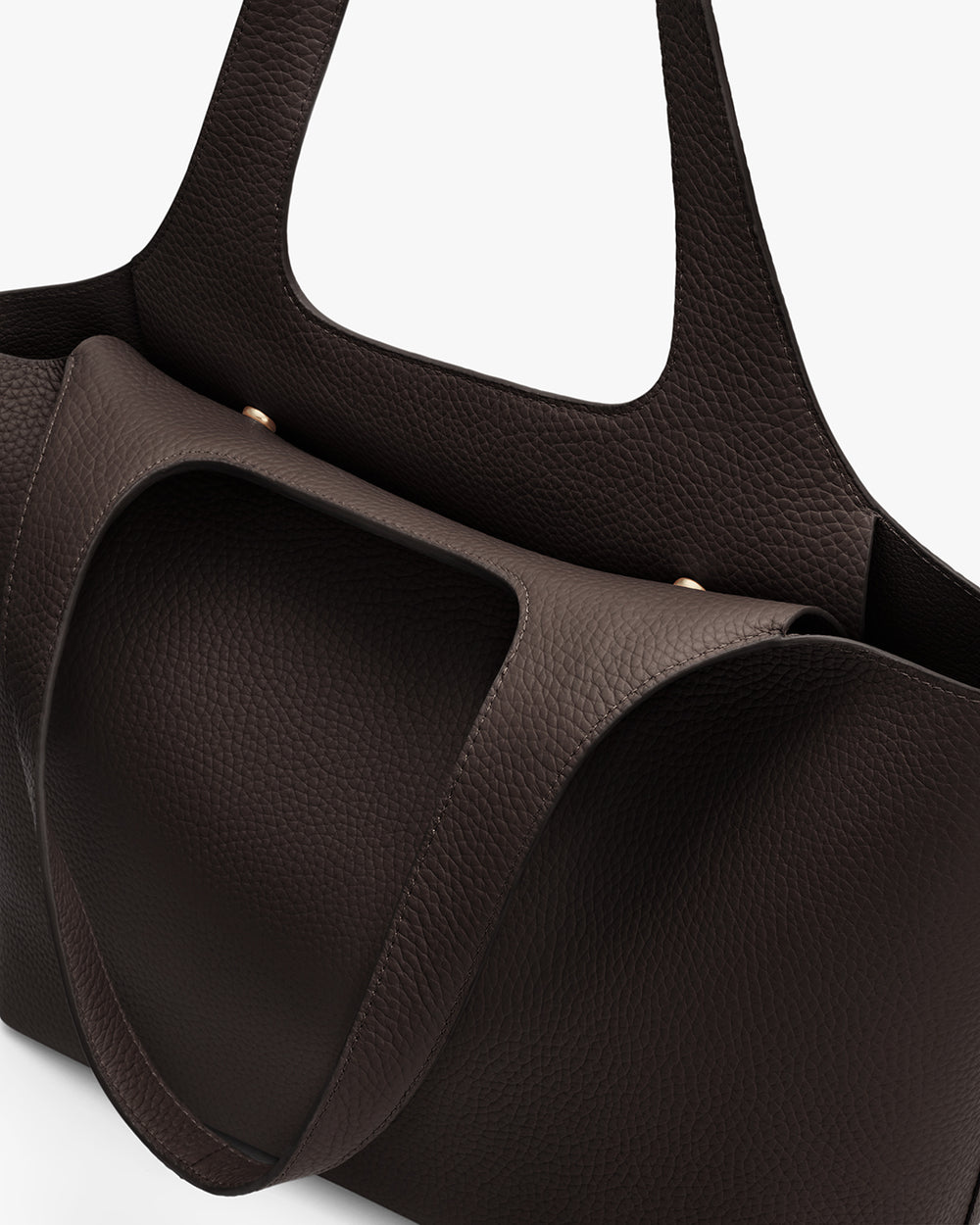 Tote bag with textured finish and structured handles.
