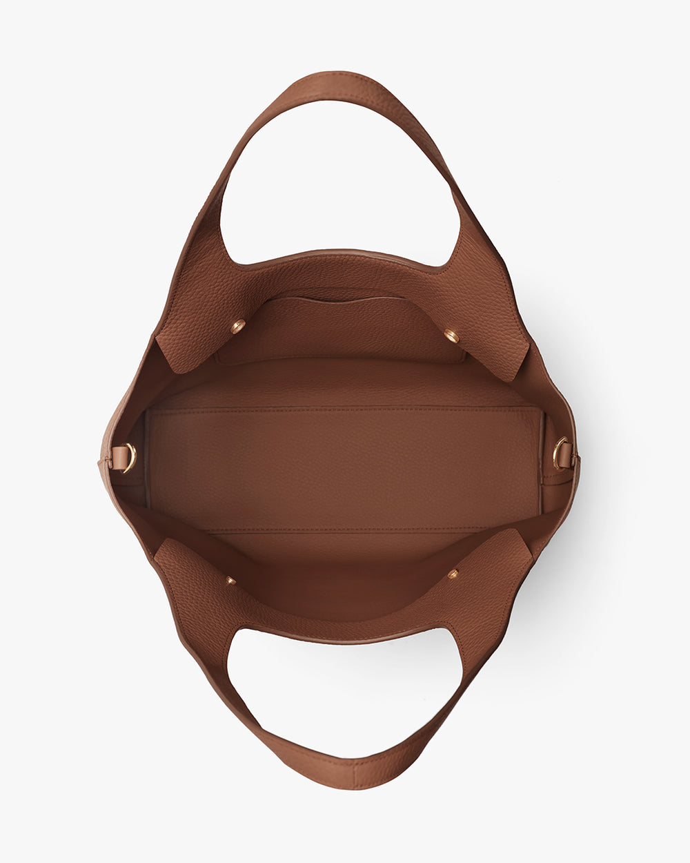 Open handbag with wide handles viewed from above.