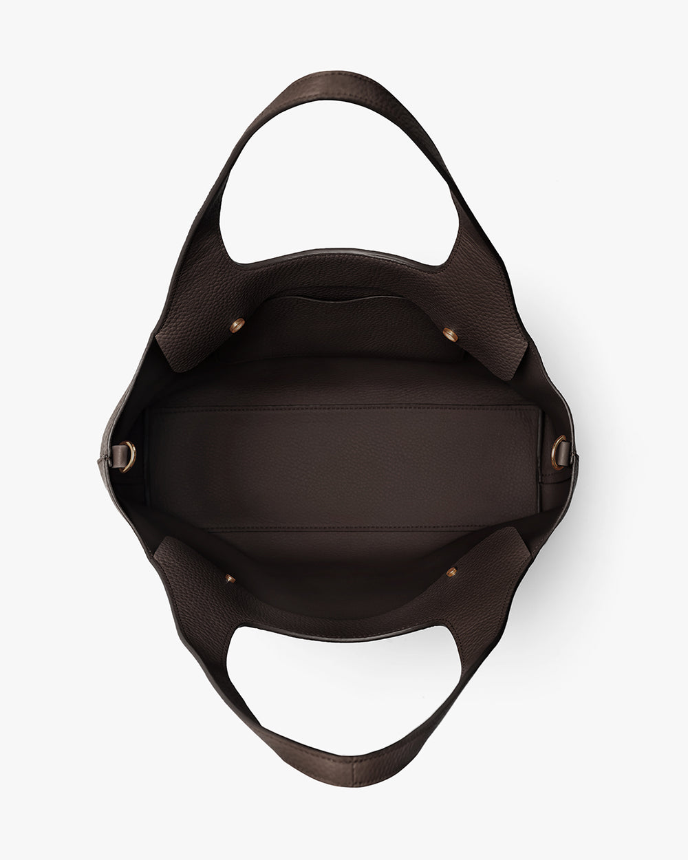Open empty handbag with wide straps and buckle details seen from above.