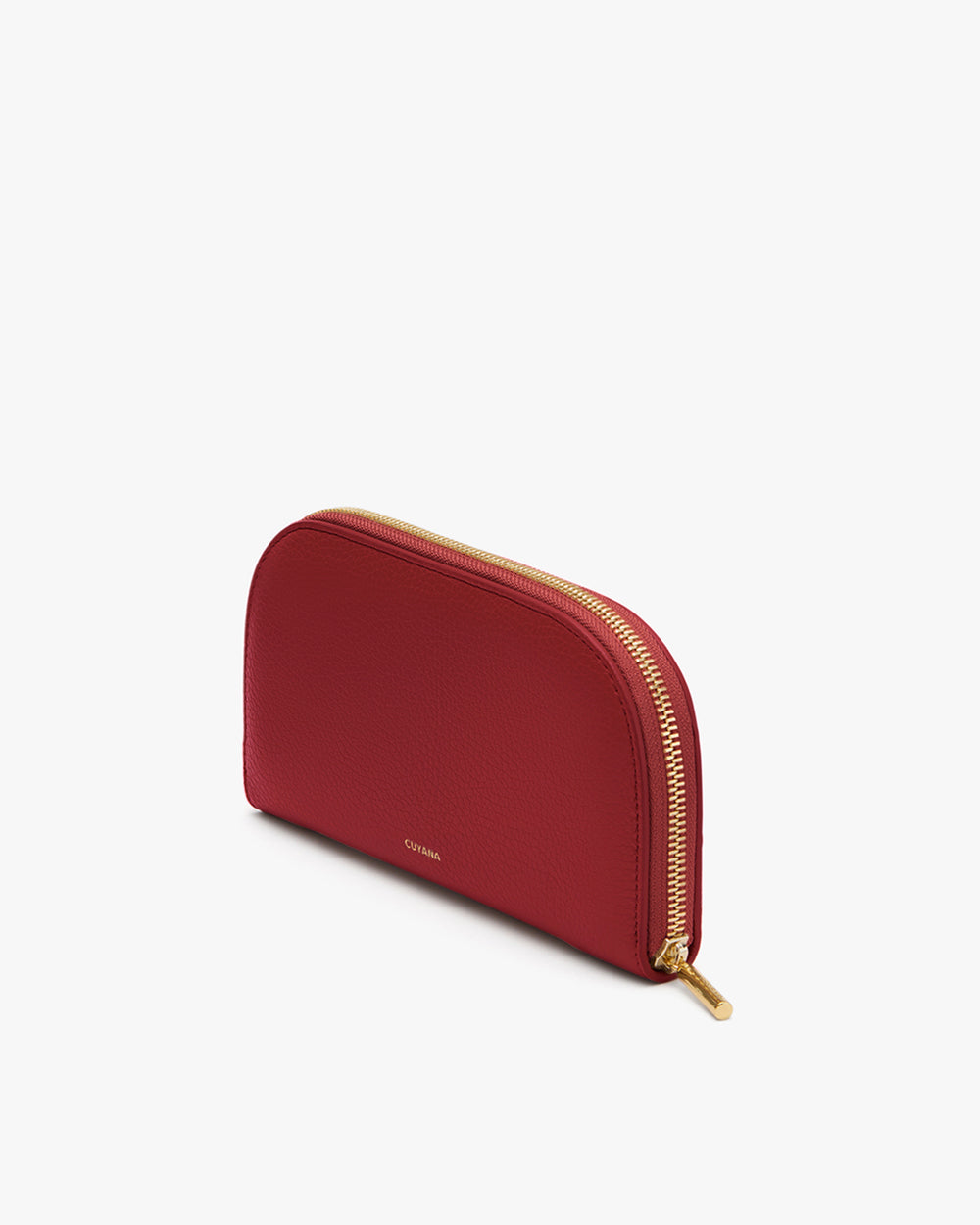 Wallet with a zipper closure and curved top edge placed on a flat surface.