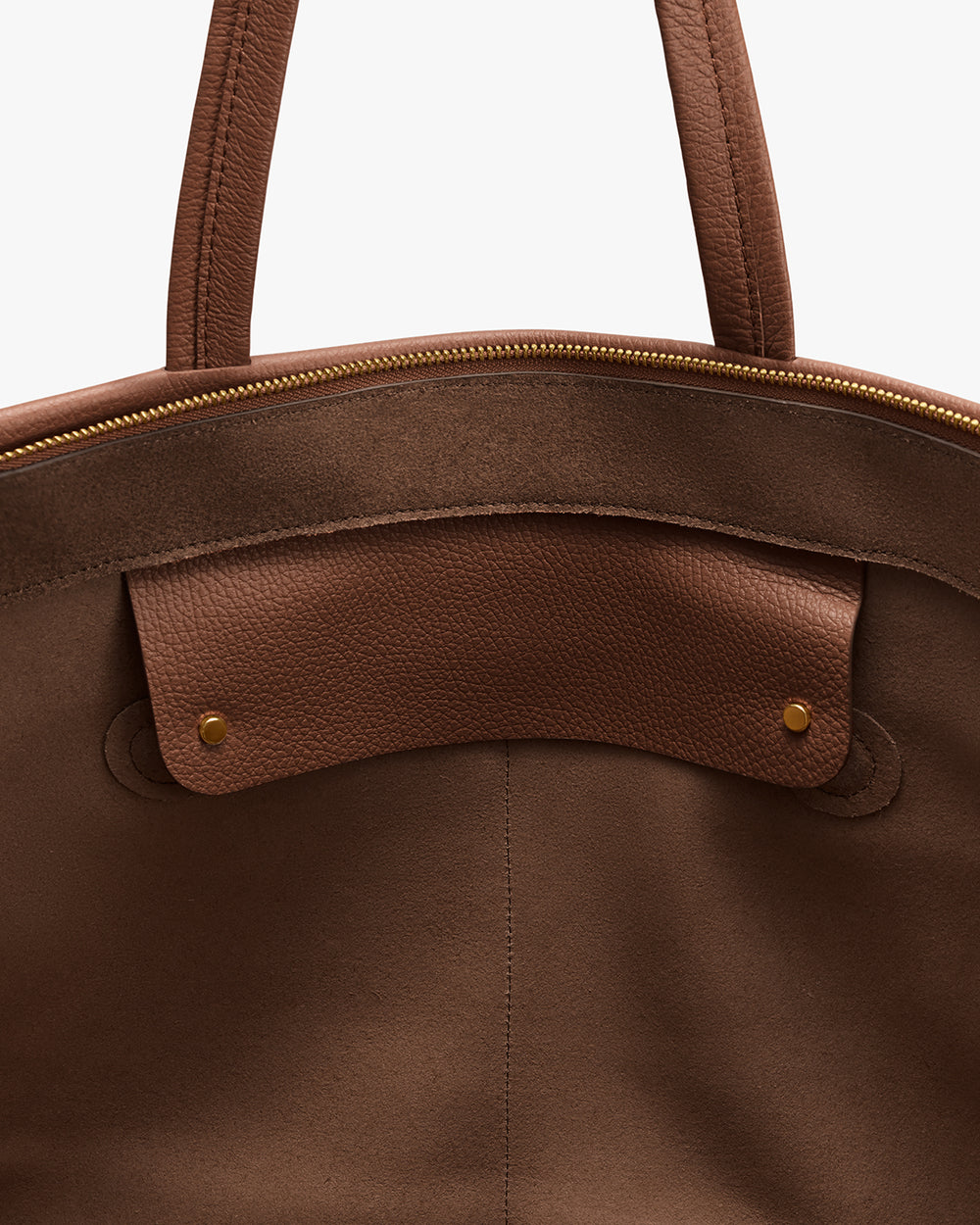 Open travel bag with visible interior pocket and zipper.