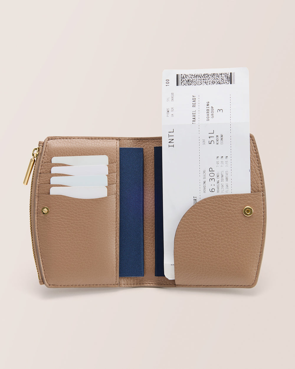 Open wallet with cards and boarding pass visible.