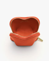 Small open pouch with a zipper and brand name inside.