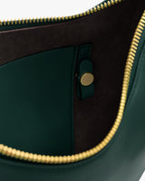 Open bag with visible zipper and buttoned pocket inside.