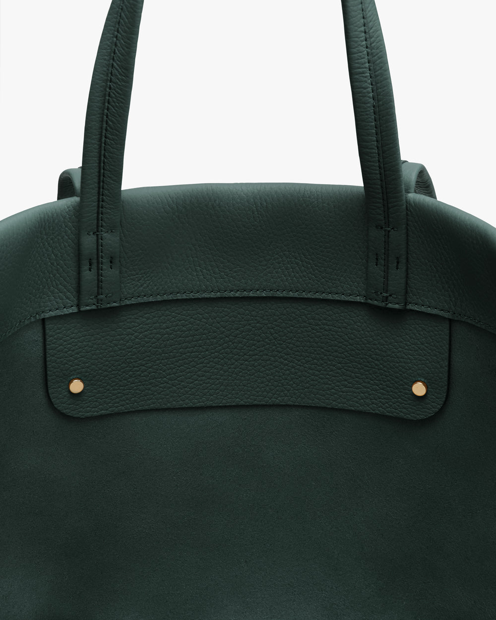 Close-up of tote bag top section with handles and two small studs.