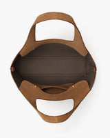 Open handbag with two handles and spacious interior.