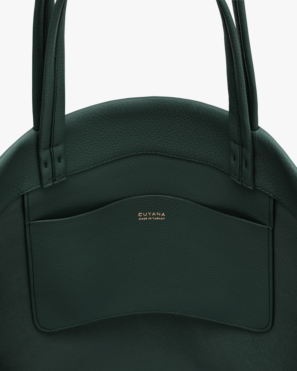 Close-up of a bag with a front pocket and two handles.