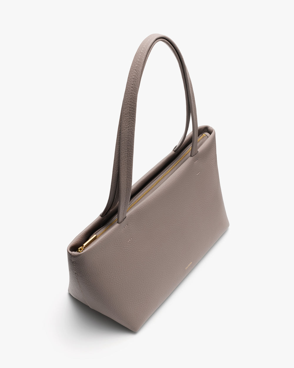 Handbag with long handles and a zippered opening.