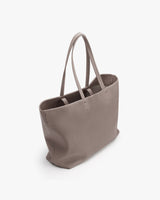 Tote bag with long handles and open top displayed on plain background.
