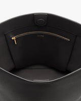 Open bag displaying a zippered pocket inside.