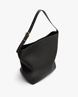 Large shoulder bag with adjustable strap and textured surface