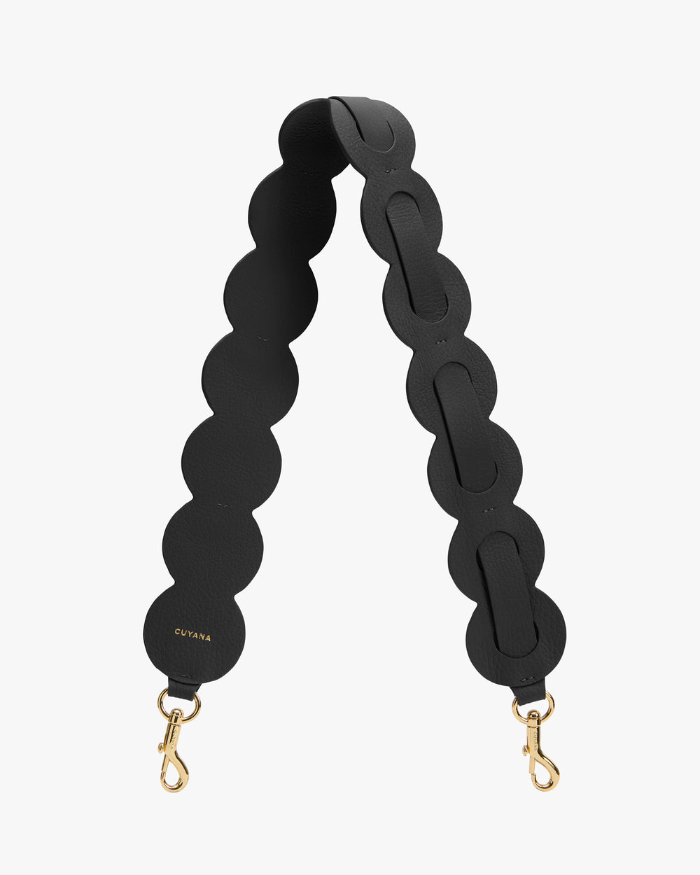 Bag strap with circular segments and gold clasps.