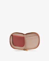 Open wallet with compartments and a zipper closure.