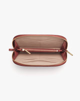 Open wallet showing card slots and zippered compartment.
