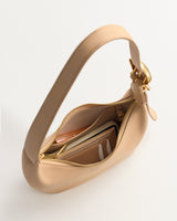 Handbag with open top showing wallet and card slots inside.