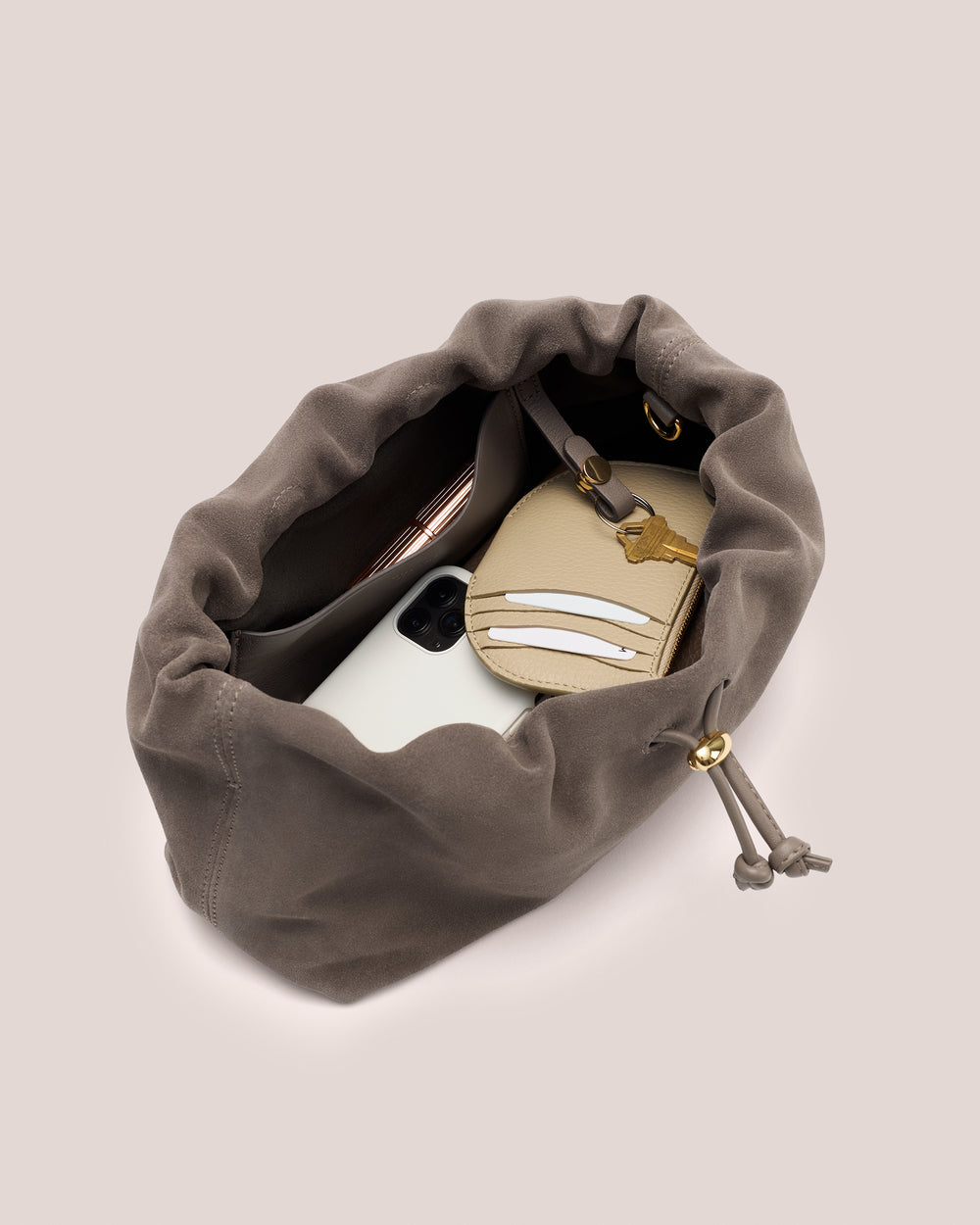 Open travel bag with phone and wallet inside.