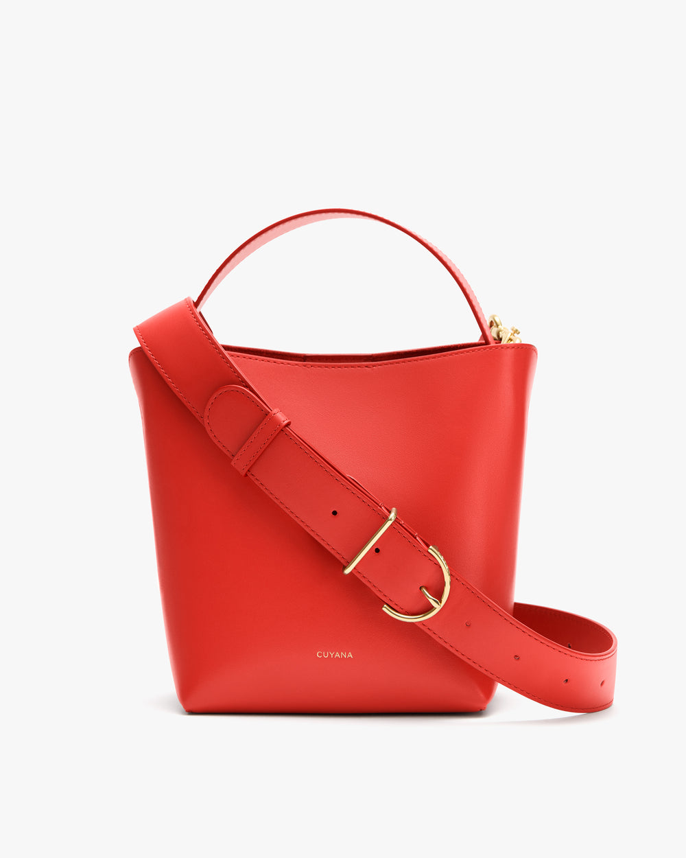 Bucket bag with a wide strap and a handle on top.