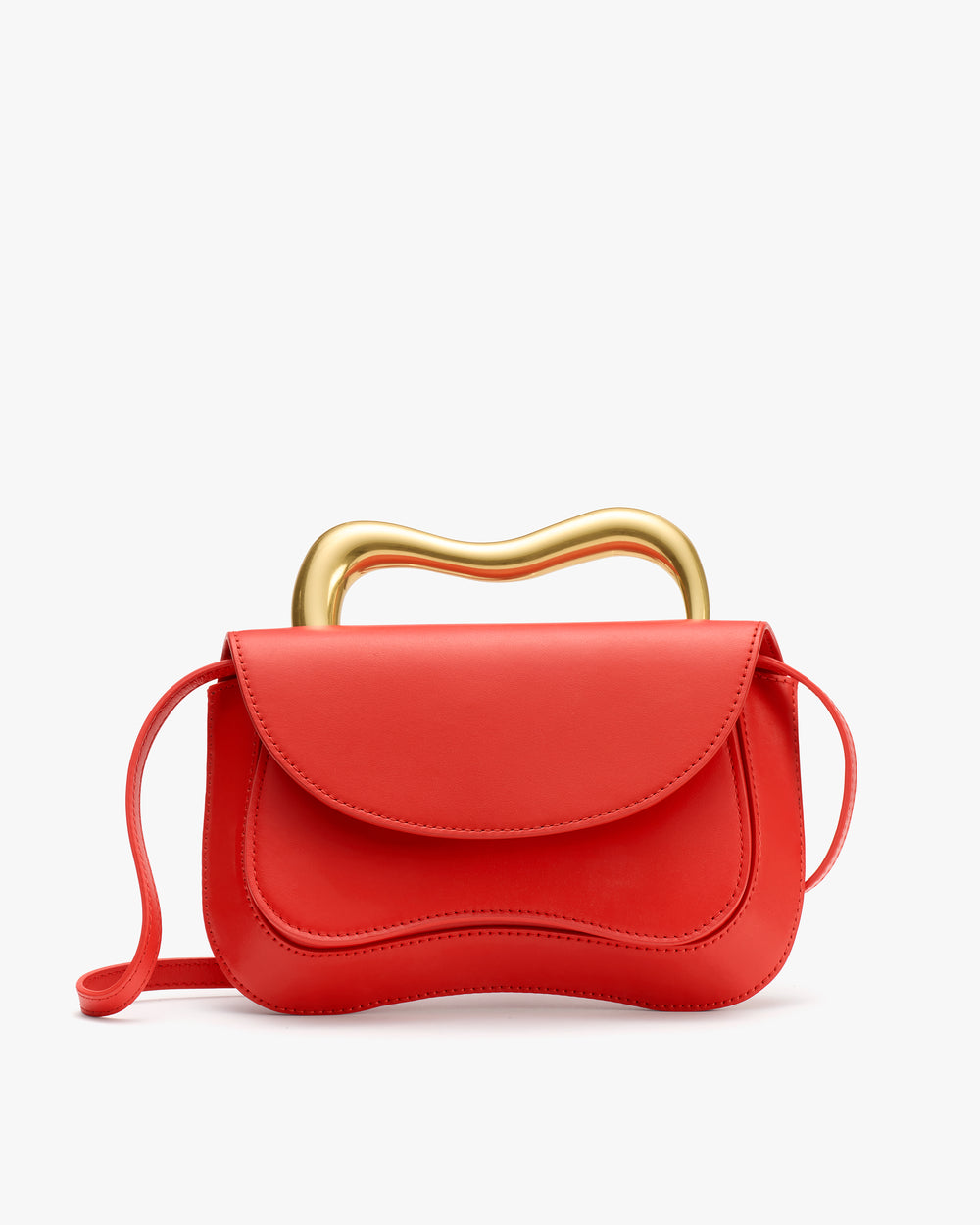 Handbag with curved handle and long strap.