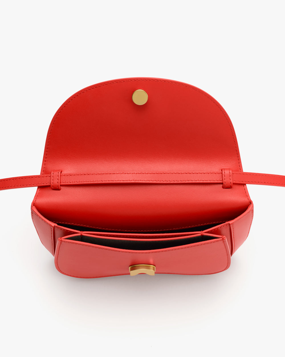 Open belt bag with a flap and visible button inside.