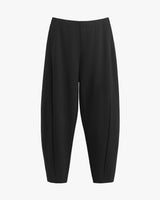 Loose-fitting trousers on a plain background.