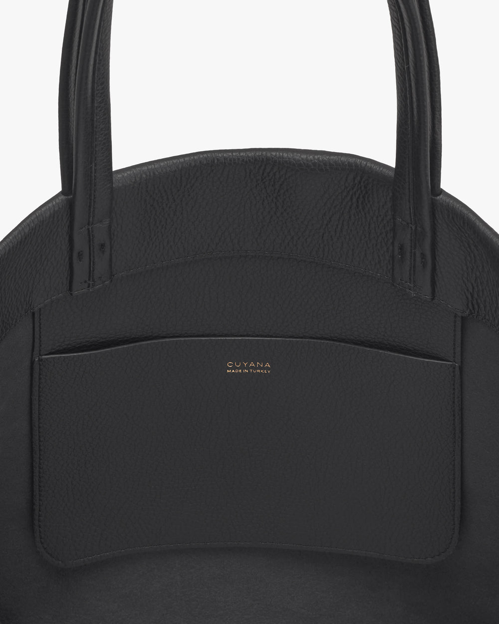 Close-up of a structured handbag with two handles and a pocket.