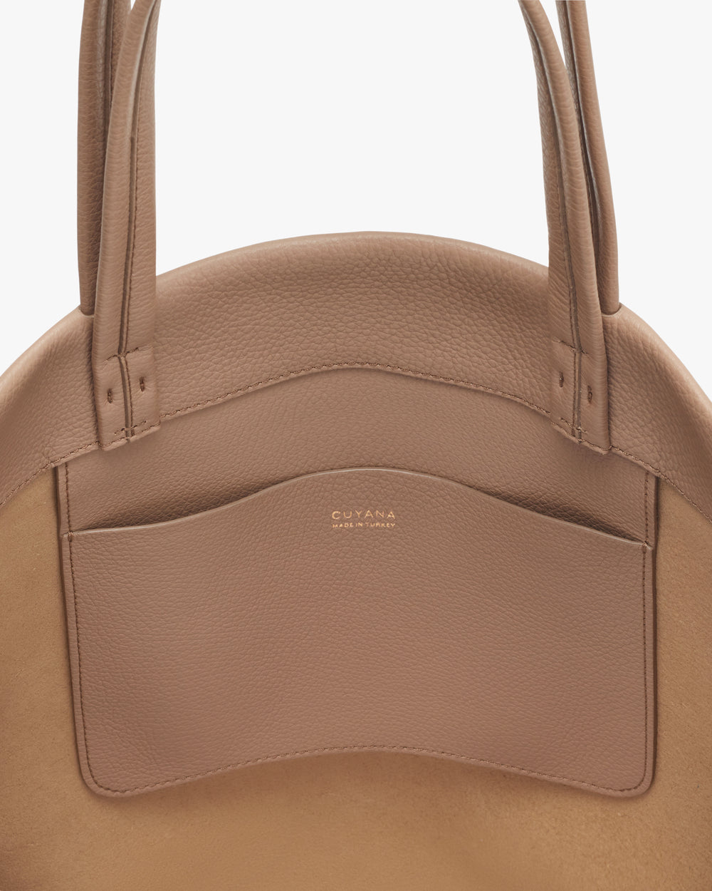 Tote bag with exterior pocket and two handles.