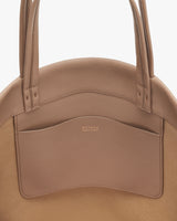 Tote bag with exterior pocket and two handles.