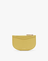 Small half-moon coin purse with zipper and embossed brand name at the bottom.
