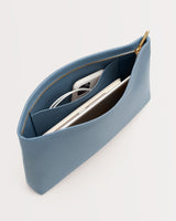 Open pouch with phone, earbuds, and a smaller item inside.